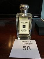 Front view of Jo Malone London Wood Sage & Sea Salt Cologne bottle showing label, cap, and liquid inside.