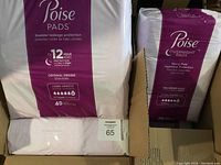 Four packs of Poise bladder leakage protection pads inside a box: three packs of Original Design Long Length Ultra with 45 pads each and one pack of Overnight Pads with 36 pads.