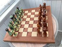 Full view of chessboard on round table with all pieces set up