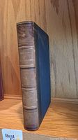 Leather bound book spine with embossed title 'History of British Columbia' and author 'A Begg'