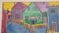 Framed original watercolour painting of colorful houses by the water.
