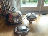 Overview of turkey dome, chafing dish and serving bowl arranged on floor