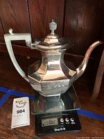 Front view of pot on Starfrit digital scale showing weight approx 684g.