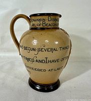 Front three-quarter view showing body inscriptions 'I have begun several things...' and handle