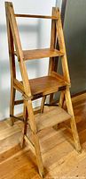 Maple library ladder chair in ladder configuration showing three wooden shelves