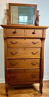 Full front view of pine highboy dresser with swivel mirror