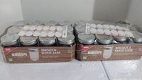 Two trays holding a total of twenty-two Bernardin smooth sided canning jars with lids in original packaging.