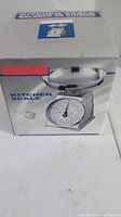 Box of kitchen scale showing image of the scale with stainless steel bowl and dial
