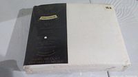 Packaged new double ivory sheet set with 200 thread count and slight wear on packaging.