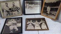 Five framed black and white photos of baseball players and game scenes, some featuring New York Yankees uniformed players