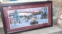 Full view of the framed winter village print by William Breedon showing the scene with houses, snow, and horse-drawn sleigh.