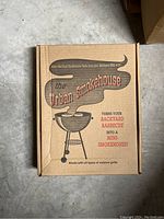 Box of Urban Smokehouse Mini Smoker Box showing artwork and usage claims on front