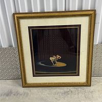 Full front view of framed artwork showing dancing ballet couple in spotlight on a stage.