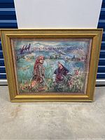 Full view of the Hibel poster inside the gold frame showing a detailed scene with two women and a landscape background.