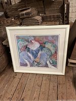 Framed Barbara Wood artwork, signed, showing a woman in a blue dress with flowers, frame shows damage