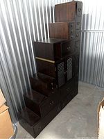 Front-left view of stepped wooden dresser showing drawer layout and overall structure