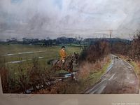 Close-up of the signed lithograph showing the riding scene and artist signature.