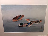 Framed painting showing three ducks in water with Asian script signature.