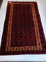 Full top down view of the hand woven Turkish tribal rug showing the geometric octagonal pattern and borders