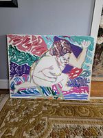 Front view of large canvas painting showing entire artwork and part of surrounding area