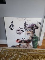 Front view of canvas print of stylized woman's face with sunglasses and glove