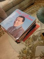 Stack of LP records showing Andy Williams on top album cover.