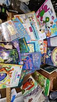 Photo showing assorted children's books including Barney, Star Wars, Ruby, Hot Rod Hamster and others