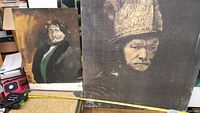Two portrait artworks on canvas side by side, showing their relative sizes and conditions