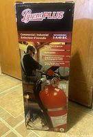 Box of Pyrene Plus commercial fire extinguisher showing branding, model and use details