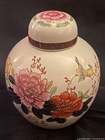 Front view of the large vintage Japanese ginger jar displaying colorful floral and bird design.