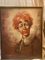 Front view of the framed print on canvas showing a clown portrait with red hair and a ruffled collar.