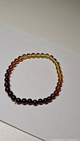 Top view of the AAA Baltic amber bracelet showing the color gradient of beads.