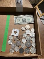 Overview of lot showing $2 note at top and assorted coins