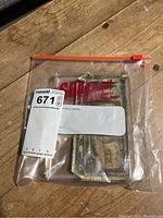 Contents in a transparent resealable plastic bag showing banknotes inside.