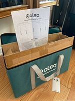 Carrying case with cardboard box inside and instruction sheet placed on top