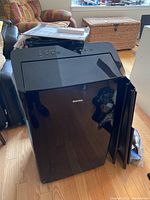 Black Danby portable air conditioner with glossy finish, front view showing logo and top control panel.