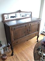 Full front view of oak sideboard with mirror attached