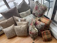 All assorted throw pillows grouped together showing variety of designs and colors.