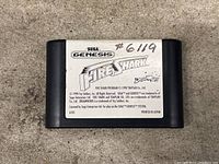 Front view of Sega Genesis Fire Shark game cartridge with label intact and handwritten number.