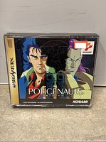 Policenauts Sega Saturn game case with illustrated cover art, showing two characters and guns.