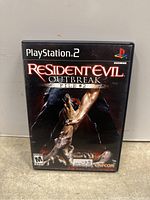 Front cover of Resident Evil Outbreak File #2 for PlayStation 2 in original black plastic game case.