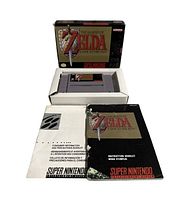 Front view of SNES game box, cartridge, instruction booklet and consumer information booklet laid out.