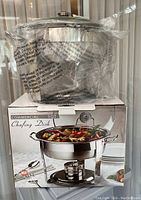 Front view of the product box with the assembled chafing dish filled with food shown on the image, indicating it is a 5 quart commercial chafing dish.