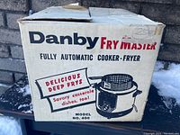 Original box for Danby Fry Master fully automatic cooker-fryer Model 400 showing brand and product information.
