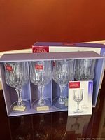 Set of four Cristal D'Arques stemware glasses in original box with accompanying product information card