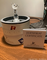Swarovski crystal cat figurine on original box with certificate booklet.