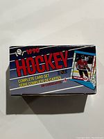Closed box of 1990 O-Pee-Chee complete hockey card set showing front and side with player photo.