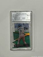 Front view of the 1999 Stadium Club Alex Rodriguez Triumvirate Luminous Die-Cut card encased in a certified grading holder showing player from behind in batting stance with grading label above