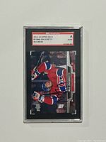 Front view of the encapsulated 2013-14 Upper Deck Max Pacioretty trading card showing the autograph and player image.