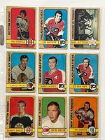 Front side of nine 1972-73 O-Pee-Chee hockey cards featuring players from Boston Bruins, Philadelphia Flyers, Chicago Black Hawks, Ottawa Nationals, New York Rangers, and a NHL Action card for Vancouver vs Toronto.